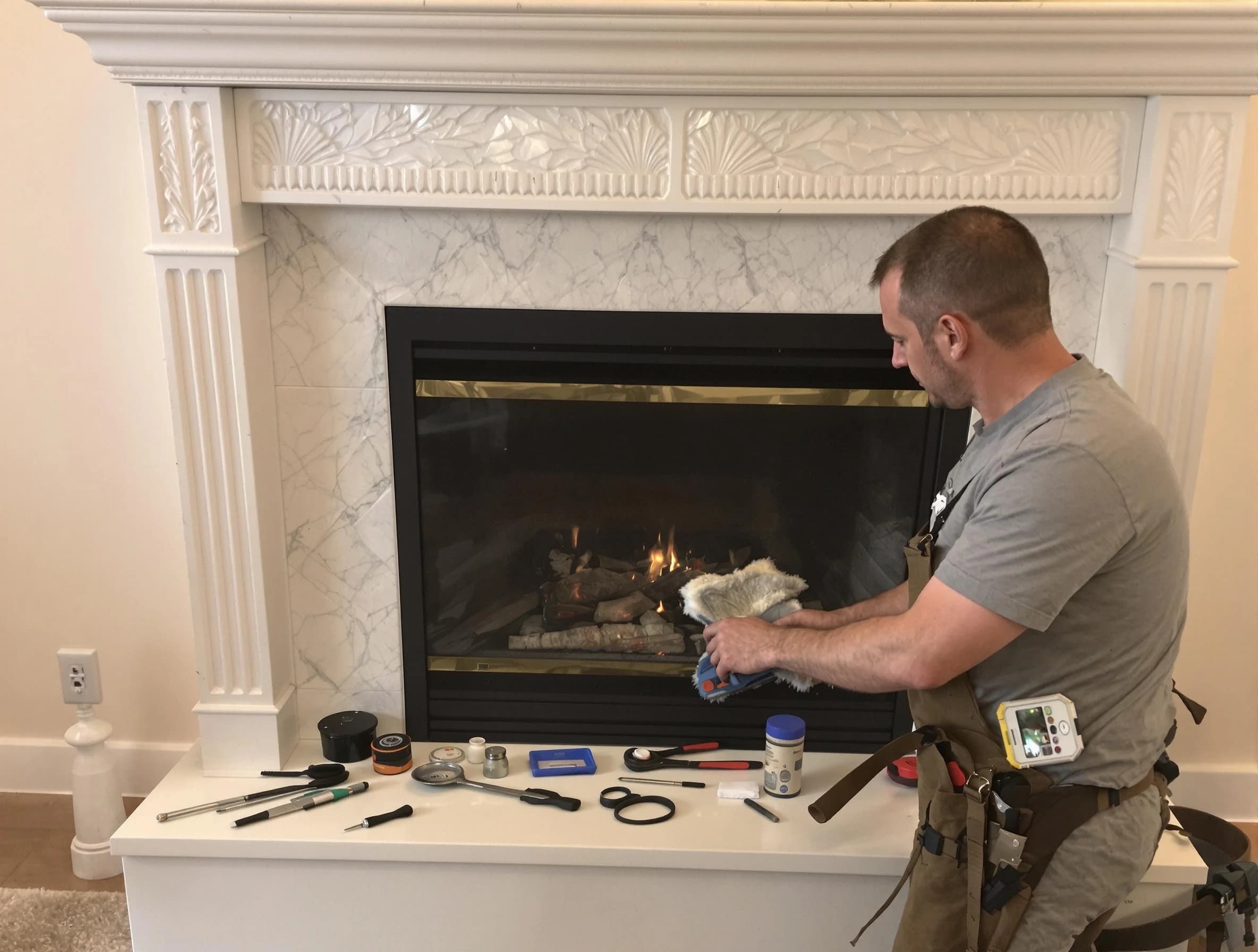 Loganville Chimney Sweep performing fireplace maintenance in Loganville, GA